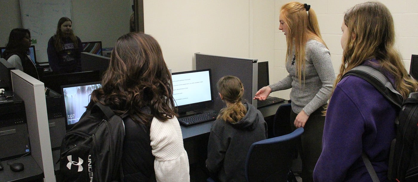 female students working together in a computer